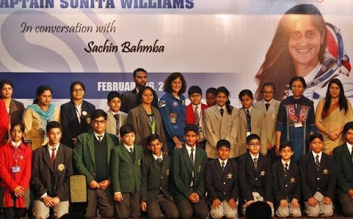 Astronaut Sunita Williams poses with school children at the India Islamic Cultural Centre, Delhi