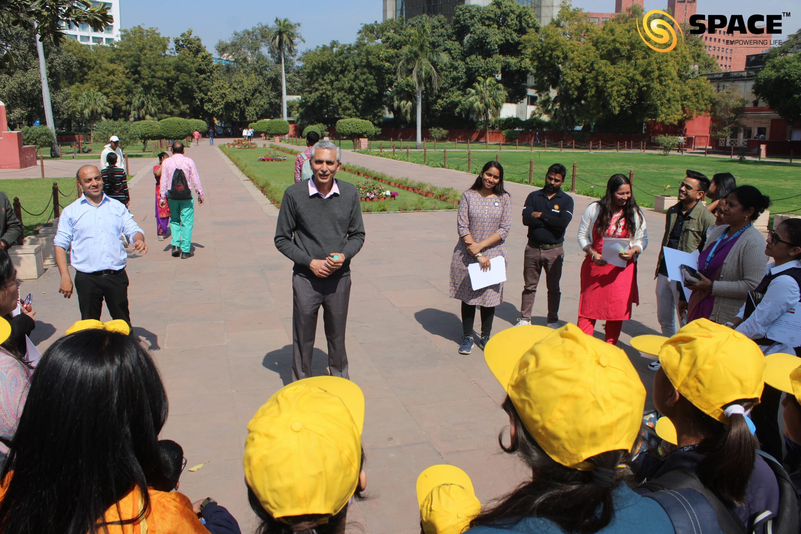 American Center Represenative addressing the students and teachers