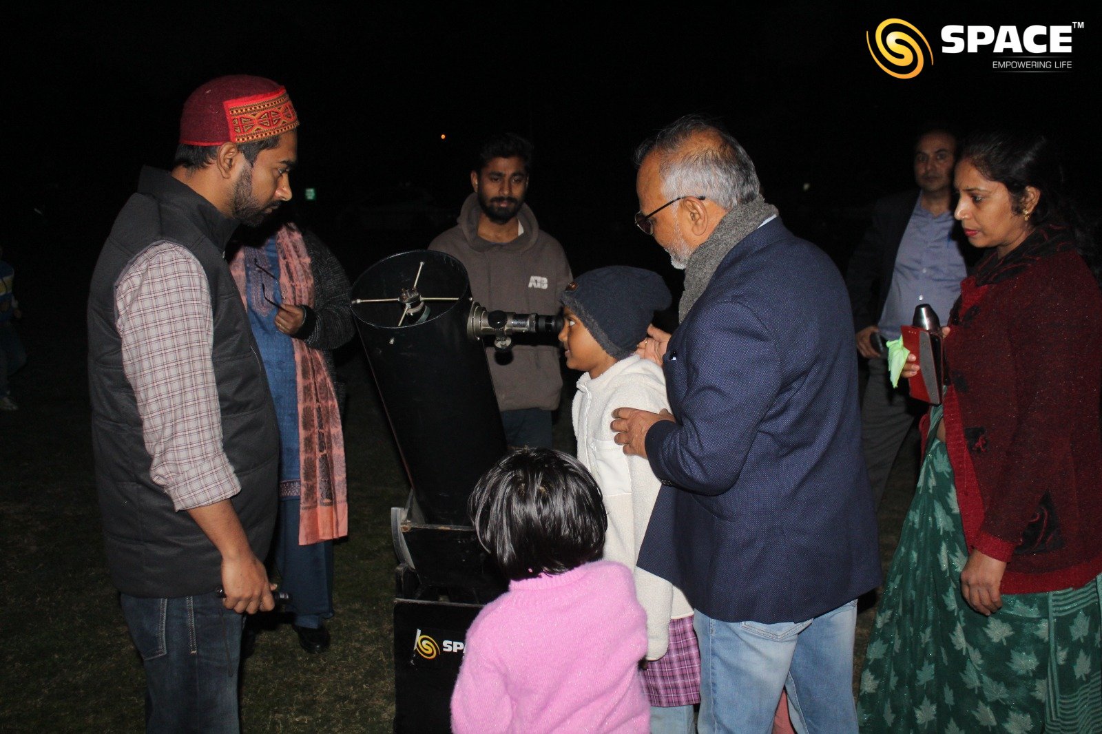 Children observing different celestial bodies