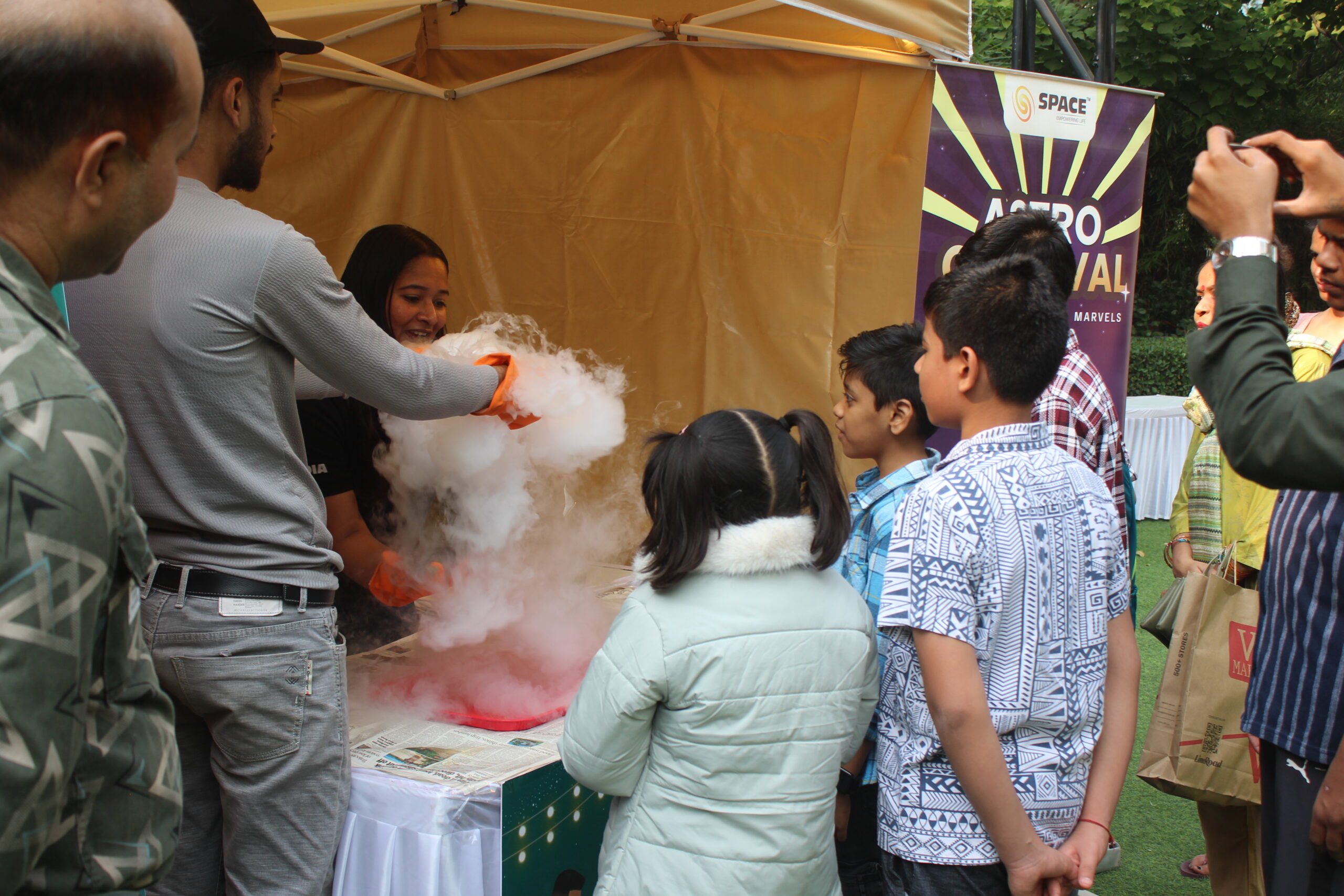 Comet making demonstration engaging young children