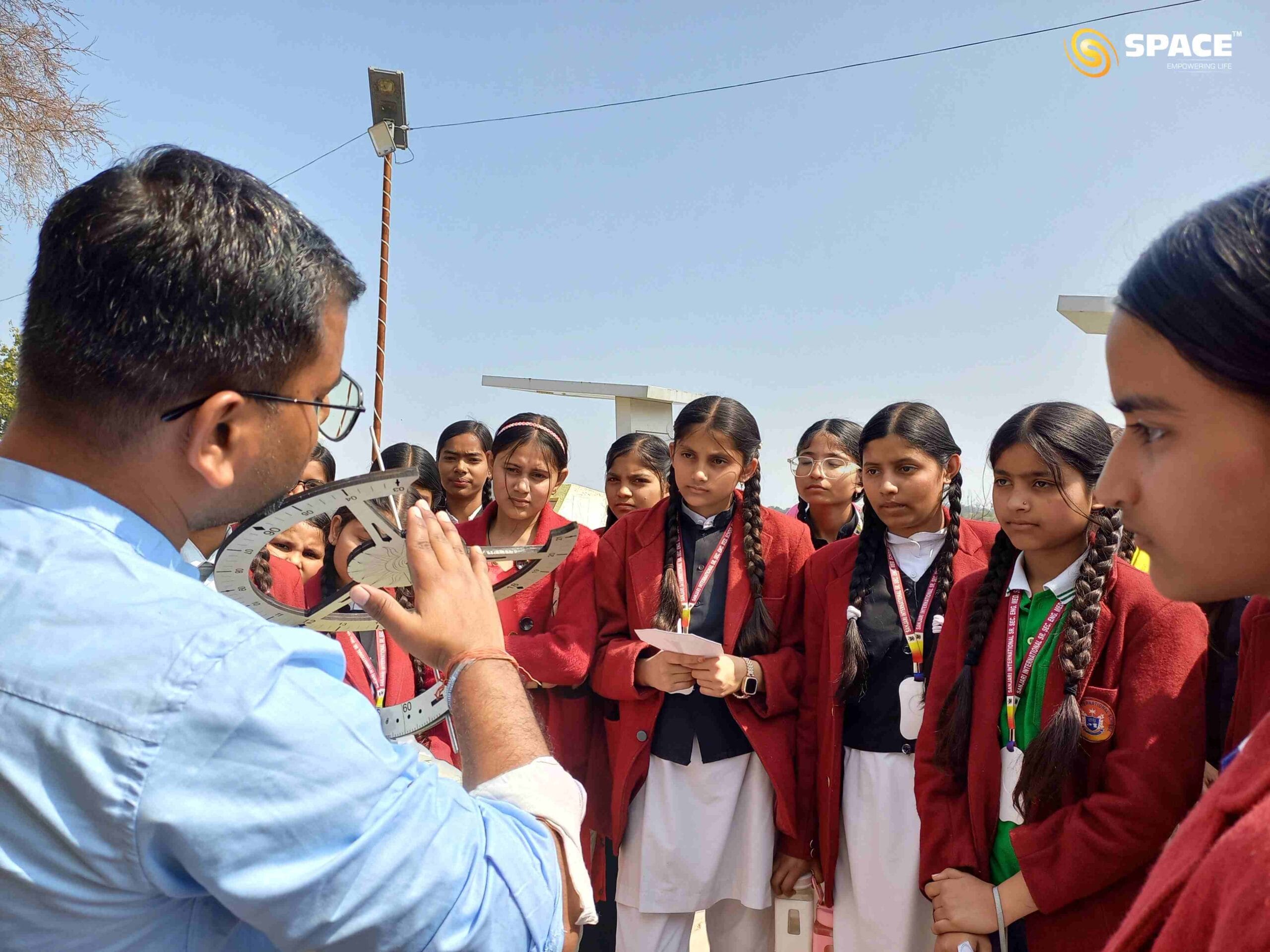 Educators demonstrating scientific principles through live hands-on sessions on sundial